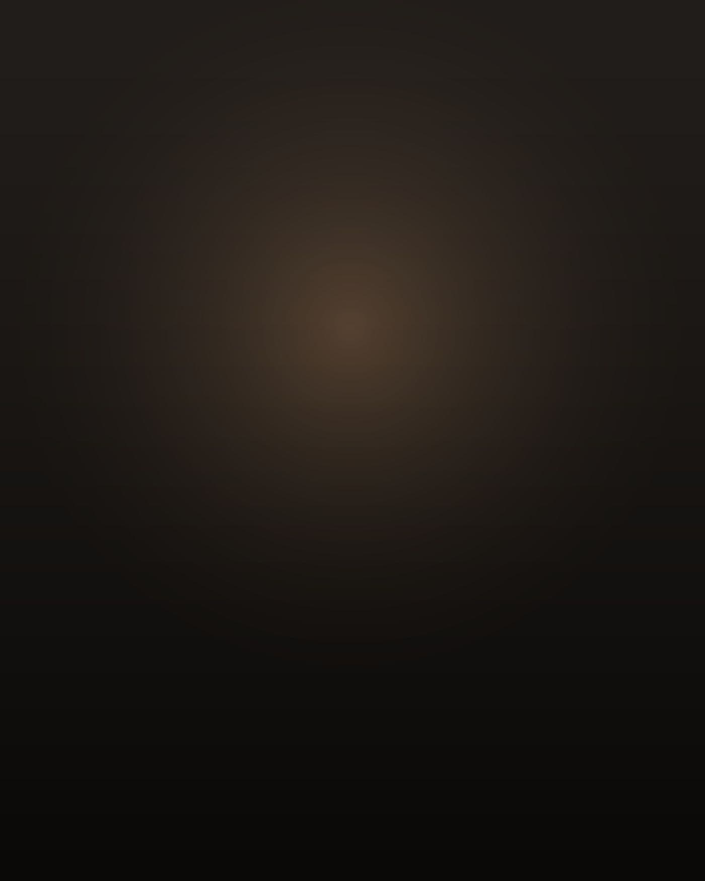 A Filipino man in his early sixties, short and wiry with thick shoulders and forearms, close-cropped grey hair, seen from behind and slightly to one side in the doorway of a dim tiled bathroom at dawn, folded white towels over his arm, a single warm bulb above the sink, fog grey in the window, his face turned away.